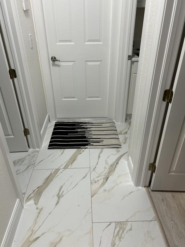 Customer photo for review titled "Cowhide Rug at Hall Entry"