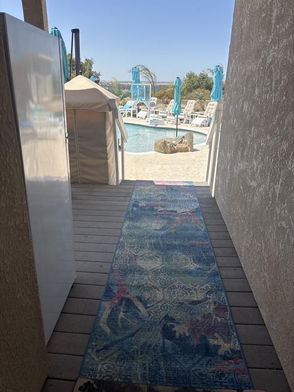 Customer photo for review titled "Love this rug and the print!"