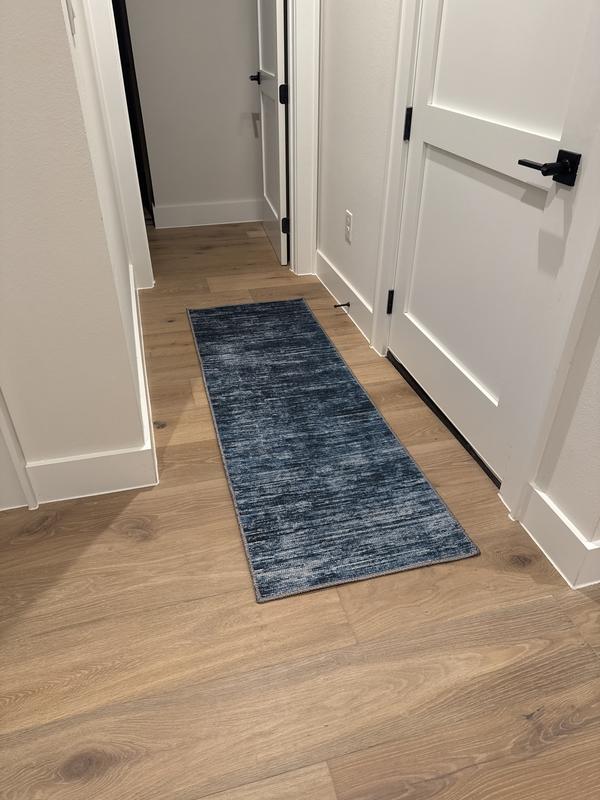 Customer photo for review titled "The 2x6 Asha runner is perfect in our new home"