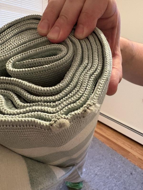 Customer photo for review titled "Cute rug but arrived damaged"