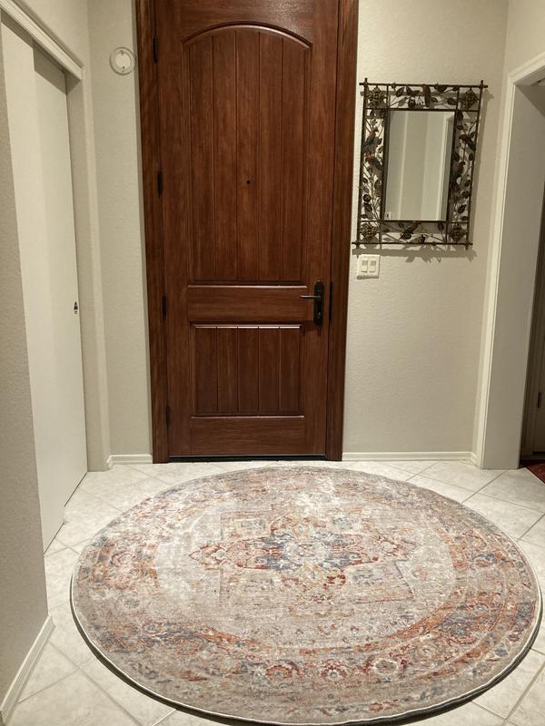 Customer photo for review titled "A beautiful and durable rug for my entryway."