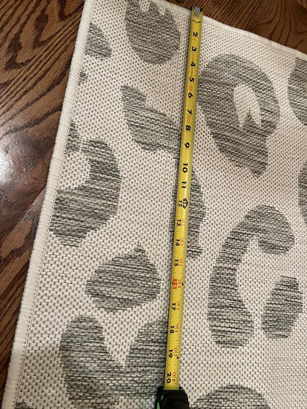 Customer photo for review titled "Received 2 damaged rugs"