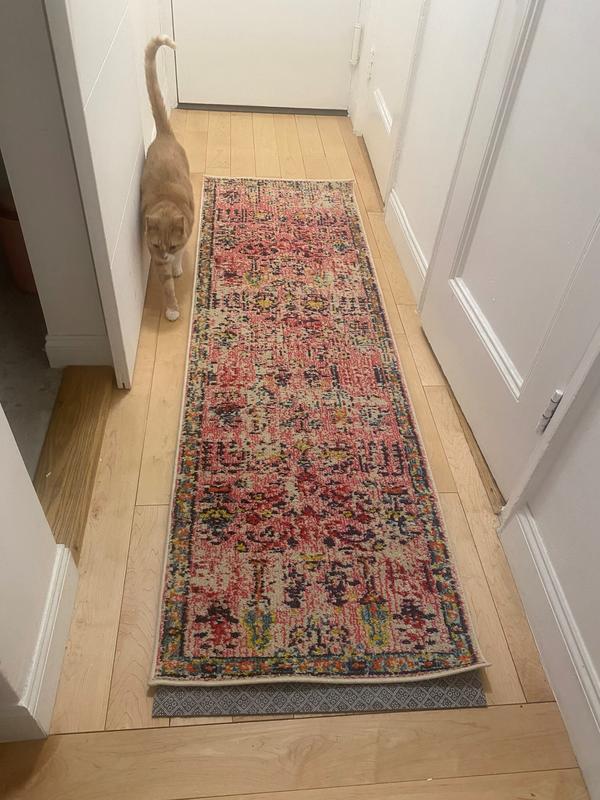 Customer photo for review titled "Beautiful rug but will take work on pad/skidding"