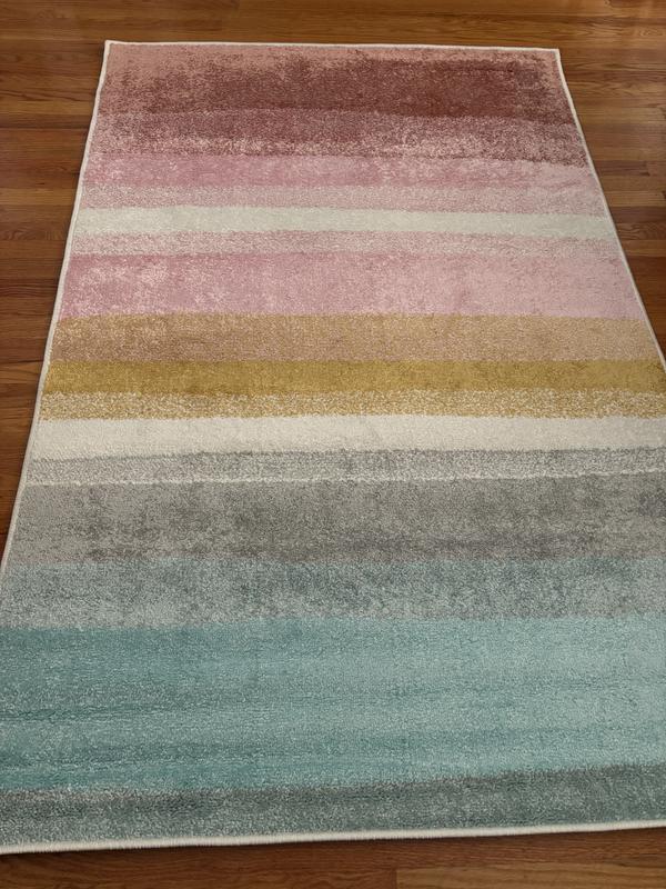 Customer photo for review titled "Very pretty rug flattened quickly!"
