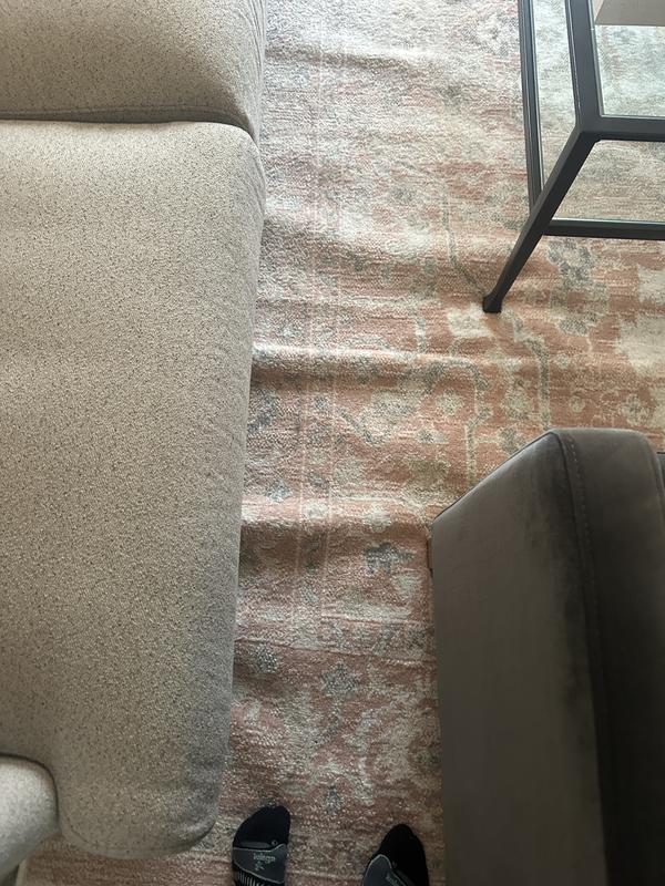 Customer photo for review titled "Horrible folds in rug. Looks cheap and tacky"