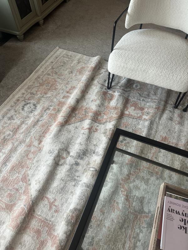 Customer photo for review titled "Horrible folds in rug. Looks cheap and tacky"