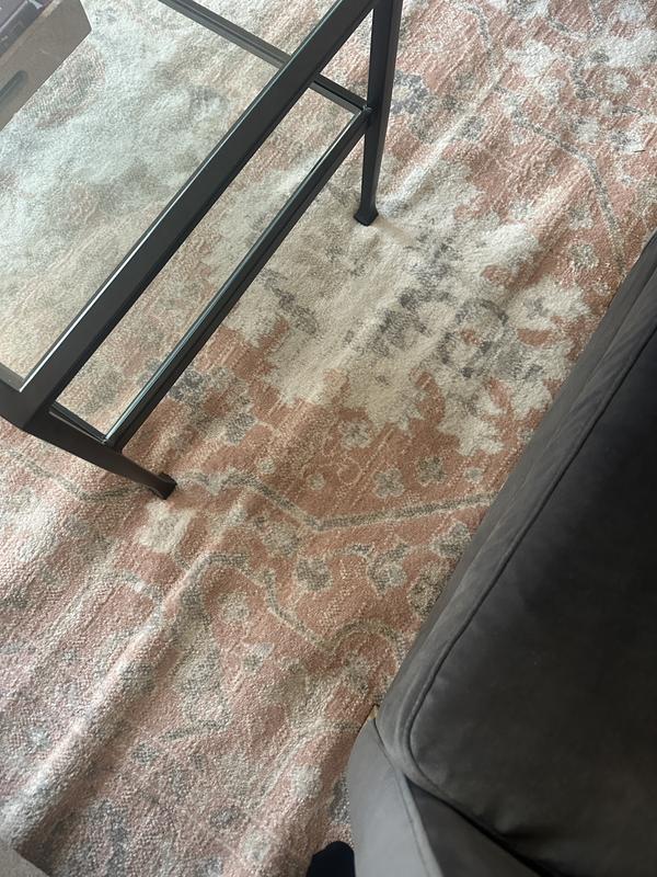 Customer photo for review titled "Horrible folds in rug. Looks cheap and tacky"