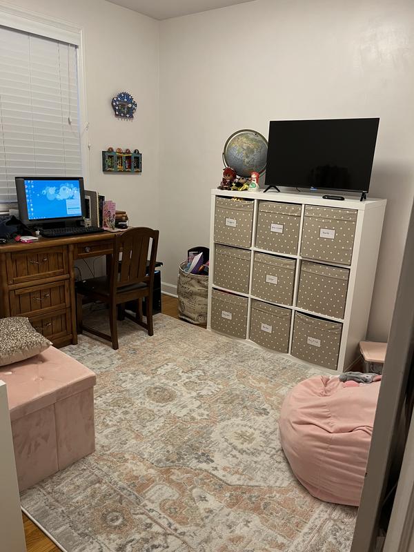 Customer photo for review titled "Pretty rug more peach than pink"