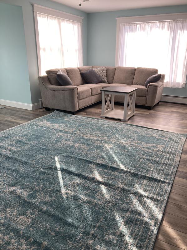 Customer photo for review titled "Bright & cozy rug"