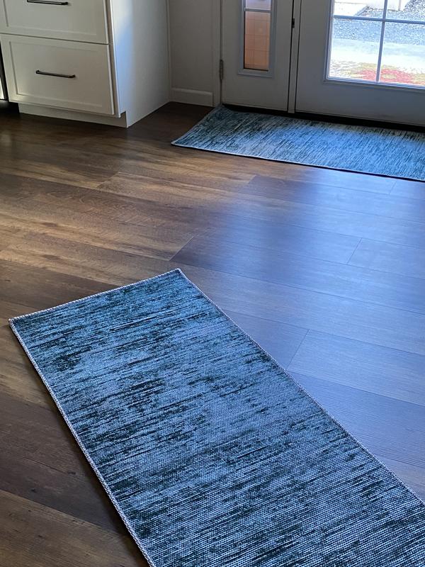Customer photo for review titled "Pretty teal runner rugs"