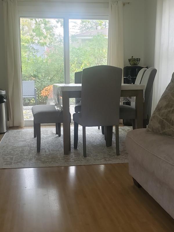 Customer photo for review titled "Dining room  rug for under my table looks great"