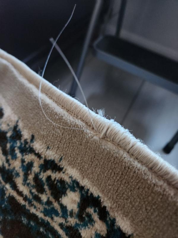 Customer photo for review titled "Nice rug but quality is poor."