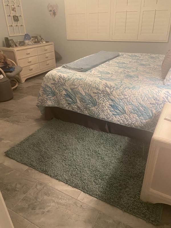 Customer photo for review titled "Practical and Colorful Bedside Rugs"