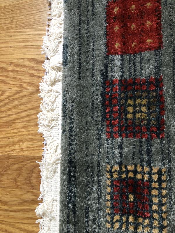 Customer photo for review titled "A must under rugs"