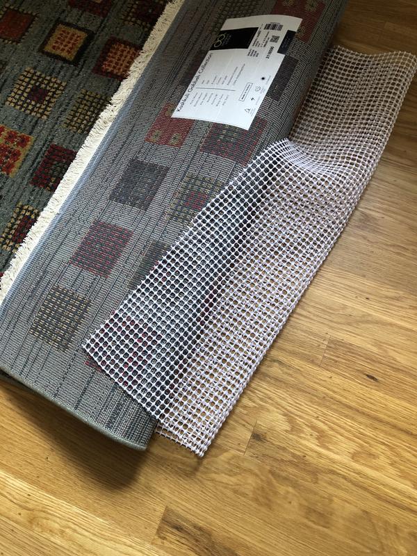 Customer photo for review titled "A must under rugs"