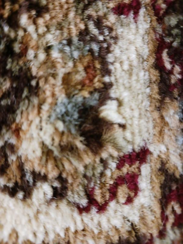 Customer photo for review titled "Nice rug but has a flaw need replacenent"