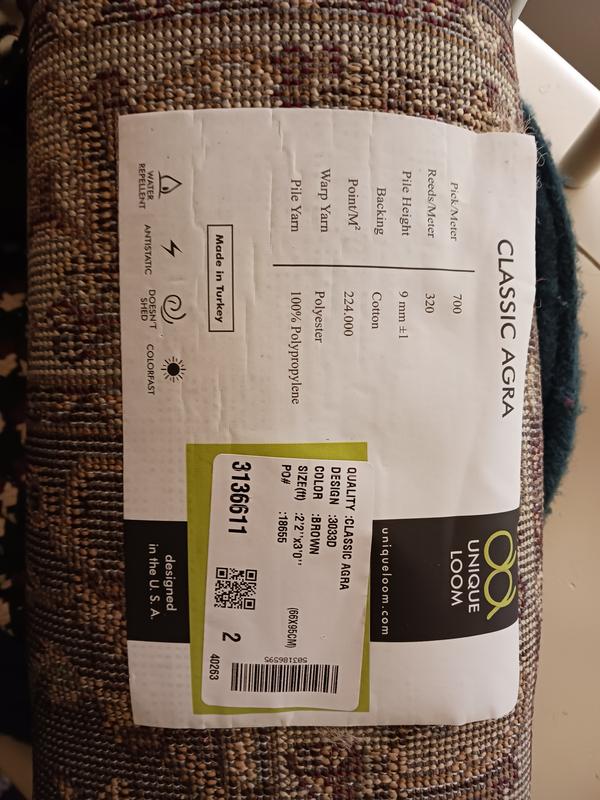 Customer photo for review titled "Nice rug but has a flaw need replacenent"