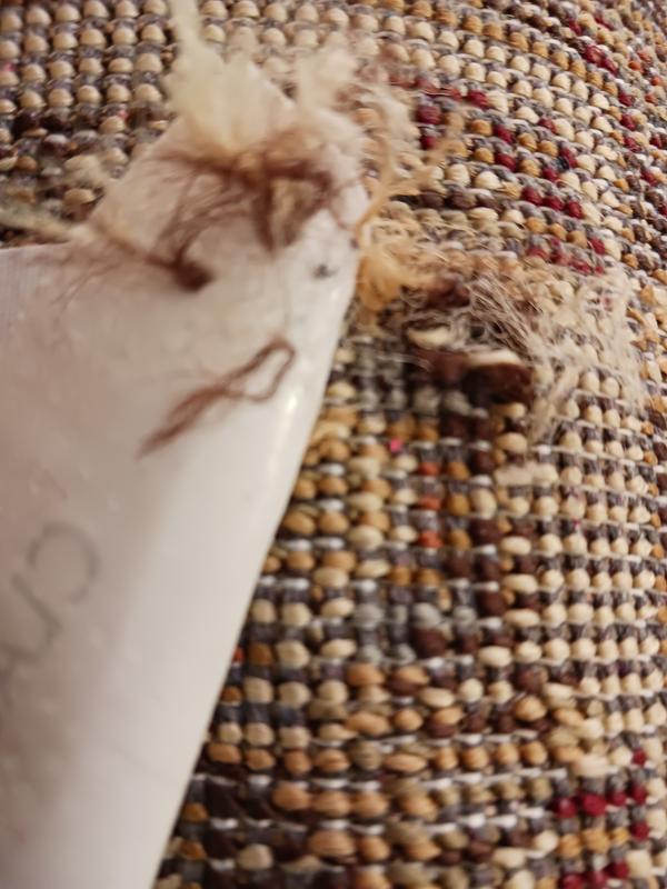 Customer photo for review titled "Nice rug but has a flaw need replacenent"