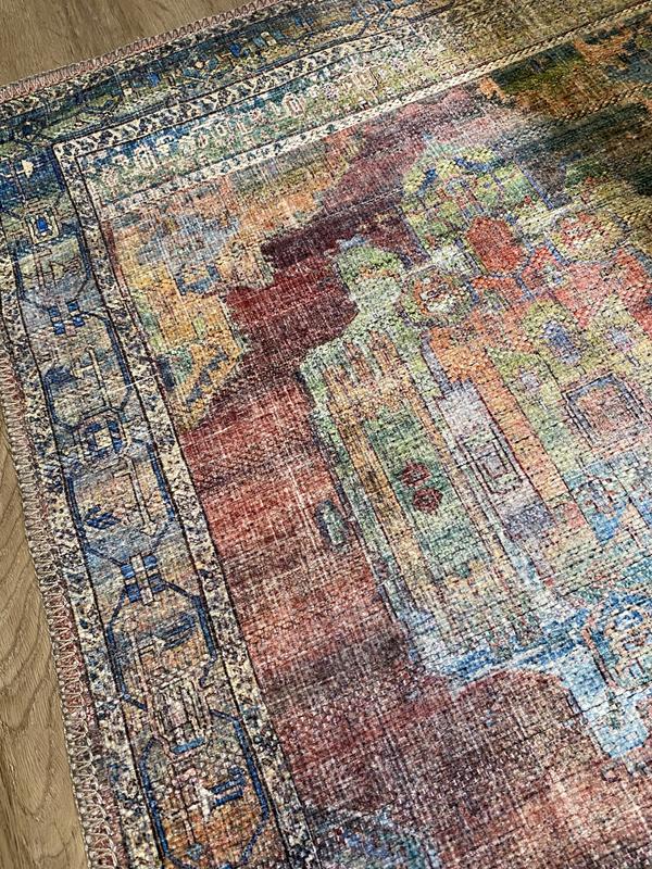 Customer photo for review titled "Very nice colors for a printed rug!"