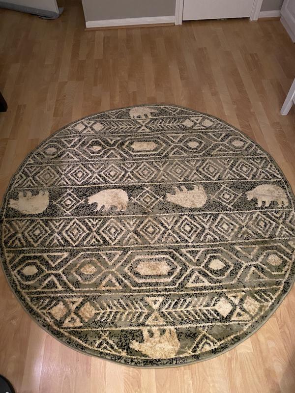 Customer photo for review titled "Perfect rug for my son’s nursery"