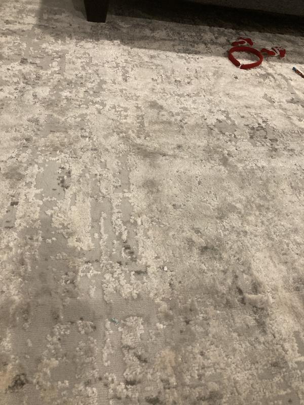 Customer photo for review titled "Lovely neutral soft rug that doesn’t lay flat"