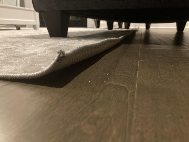 Customer photo for review titled "Lovely neutral soft rug that doesn’t lay flat"