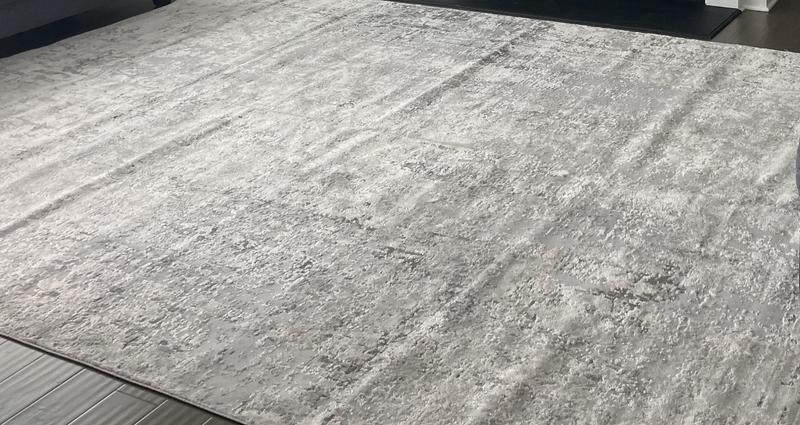 Customer photo for review titled "Lovely neutral soft rug that doesn’t lay flat"