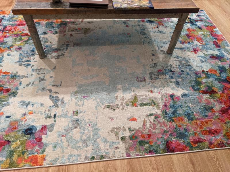 Customer photo for review titled "It's a beautiful rug but..."