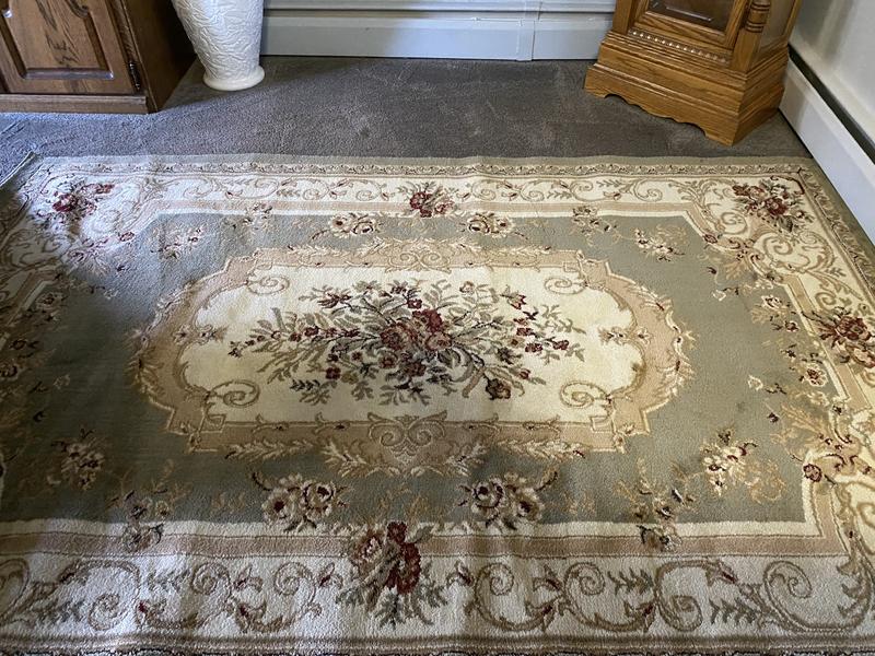 Customer photo for review titled "My dining room rug"