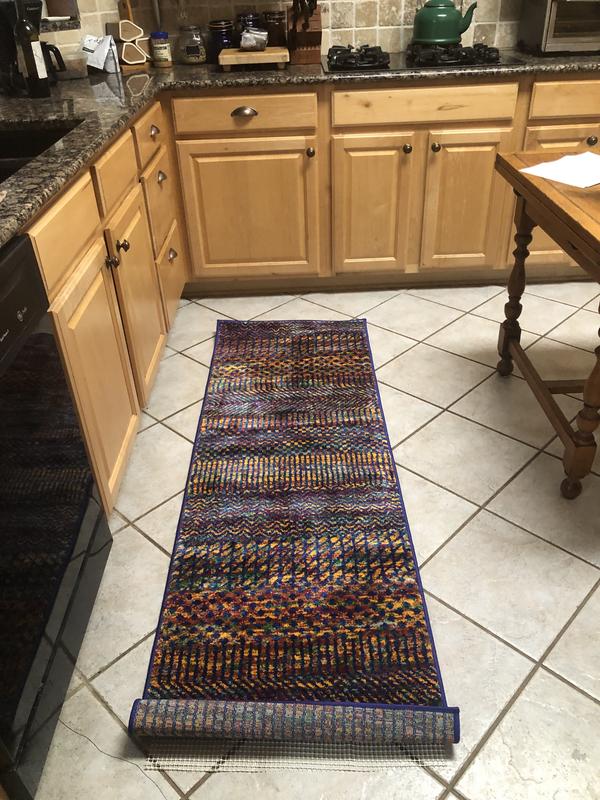 Customer photo for review titled "Colorful unique rugs!"