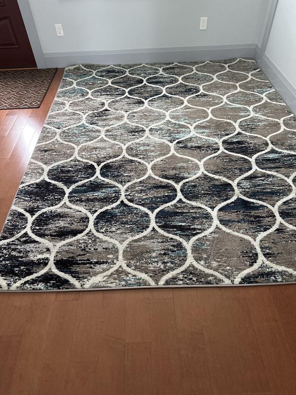 Customer photo for review titled "This rug a good quality for dining room."