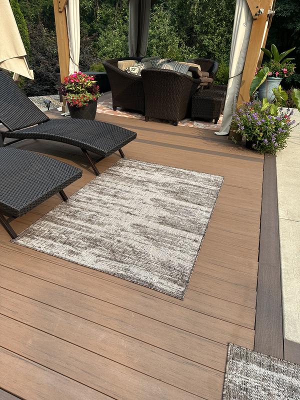 Customer photo for review titled "Great rug for over hot composite decking."