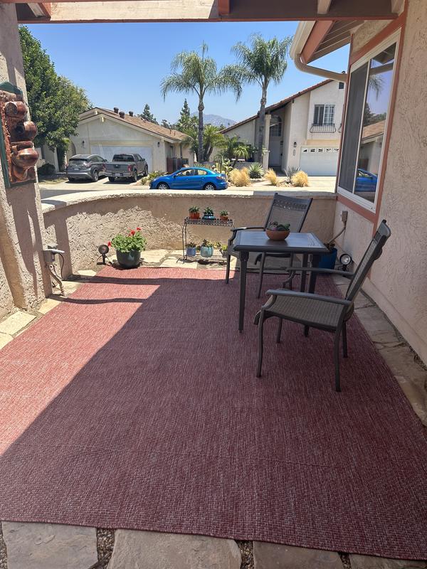 Customer photo for review titled "Perfect rug for my oatio"