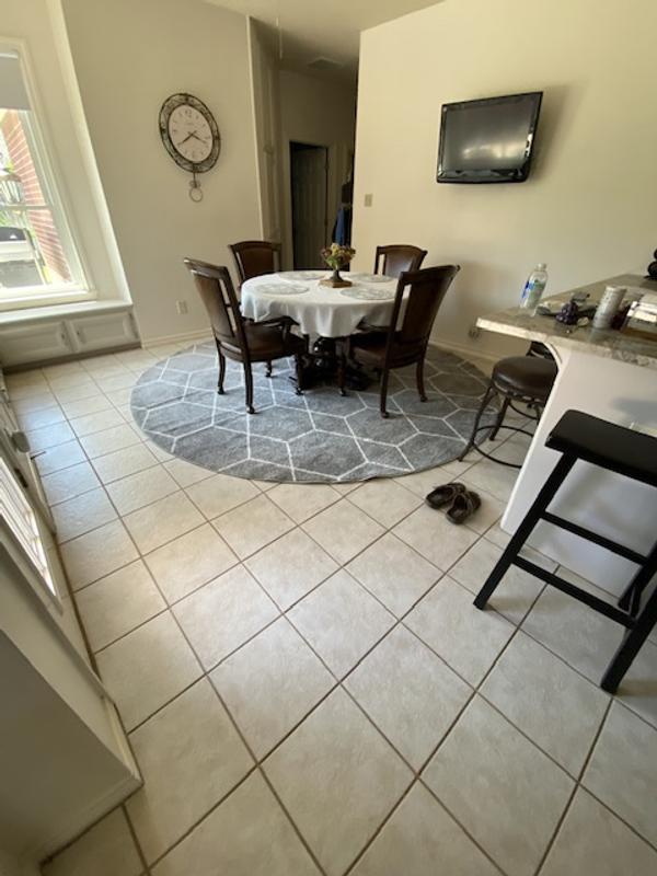 Customer photo for review titled "Rug under my breakfast table"