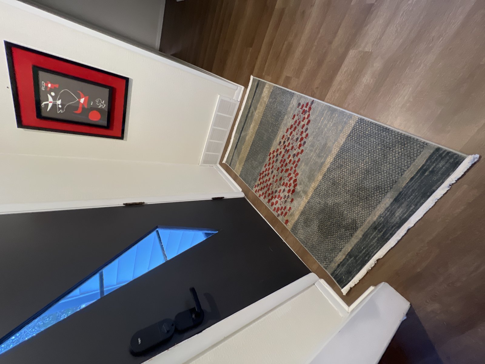 Customer photo for review titled "It’s a beautiful rug, except…"