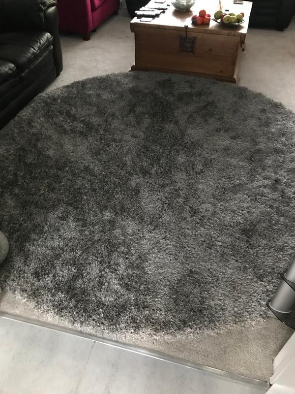 Customer photo for review titled "8’ Round Silver Dark Grey rug"