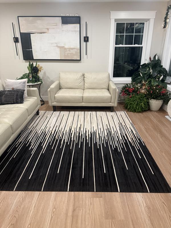 Customer photo for review titled "Cowhide rug"