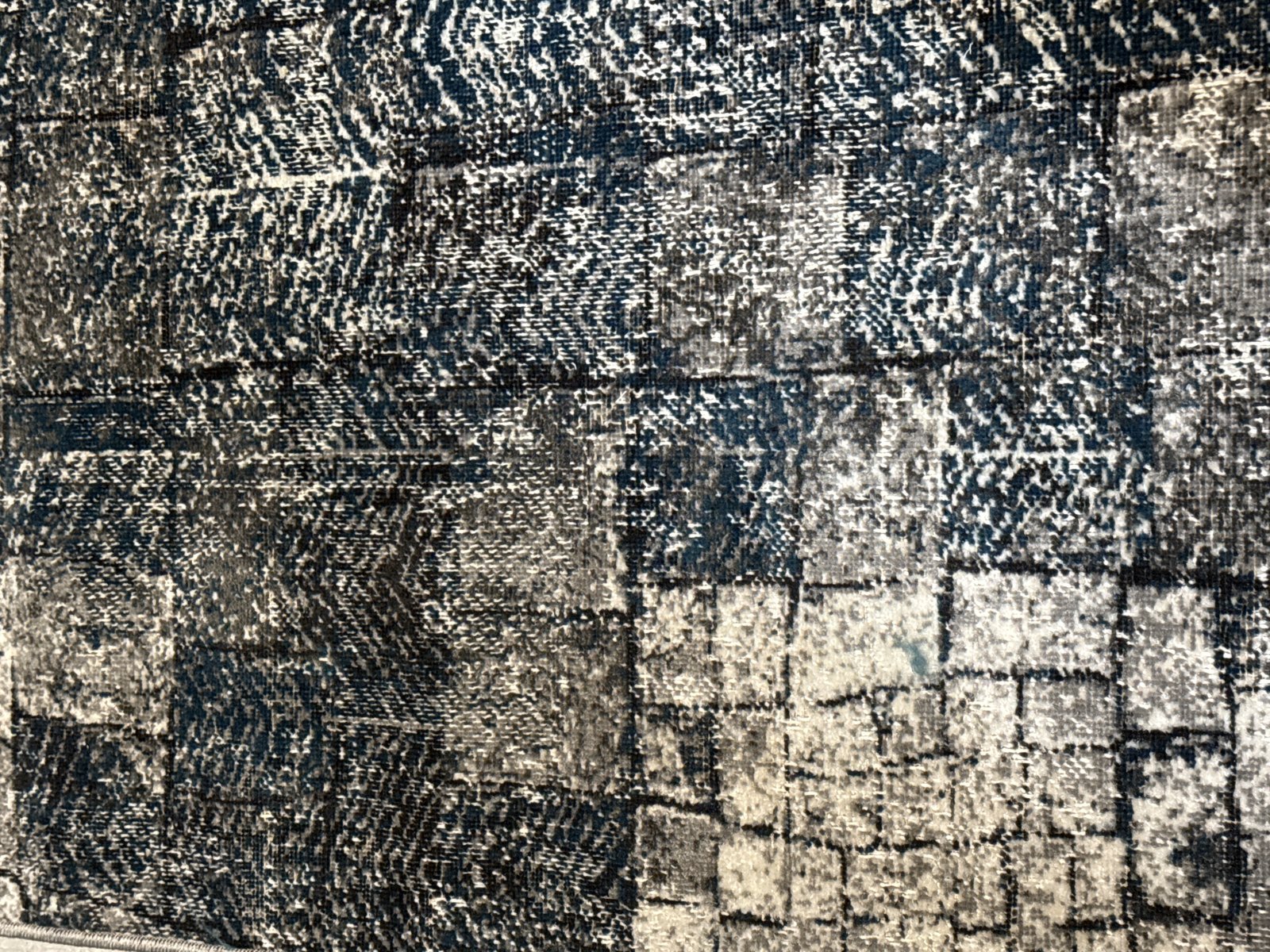 Customer photo for review titled "Color doesn’t match picture on website at all.   The rug is more green than blue."